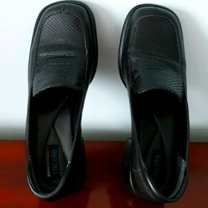 Black leather shoes, stack heels